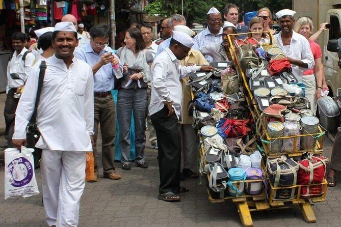 Dabbawala, Dhobi Ghat & Dharavi slum Tour with Local Train Ride - Stop 1: Dharavi streets, work lanes, and the reality of industry