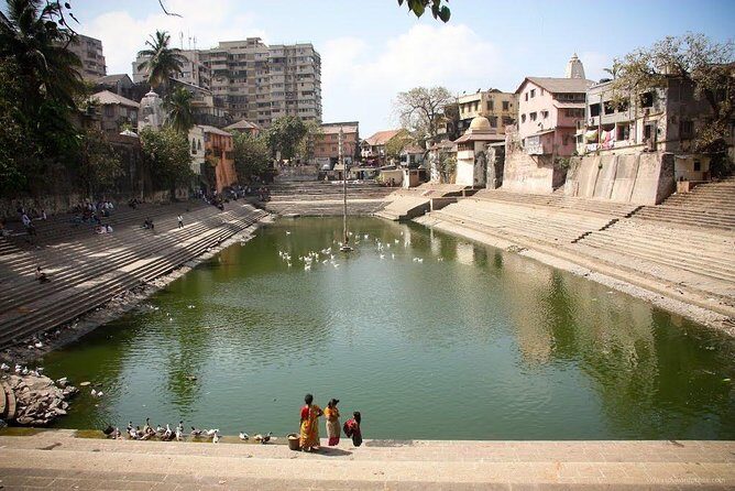 Full Day Mumbai Sightseeing Tour with Dharavi Slum - Transport, timing, and comfort on a 7 to 8 hour day